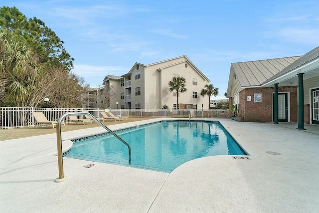 view of swimming pool with a patio