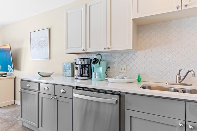 kitchen featuring gray cabinets, sink, and dishwasher