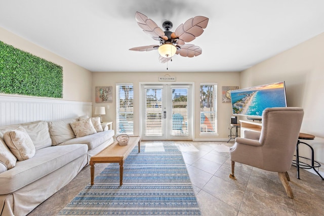 living room featuring tile patterned floors and ceiling fan