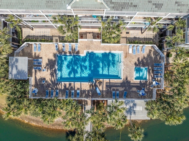 birds eye view of property with a water view