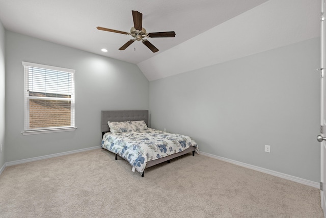 bedroom featuring ceiling fan, light carpet, and lofted ceiling