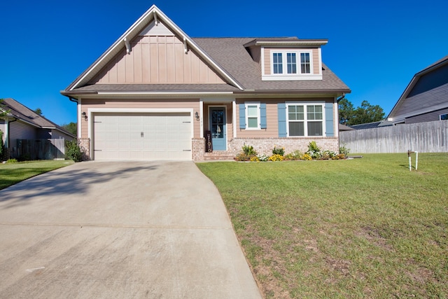 craftsman-style home featuring a front yard and a garage