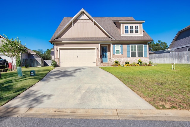 craftsman house featuring a front lawn and a garage