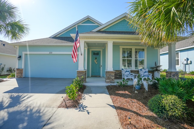 view of front of house with a porch and a garage