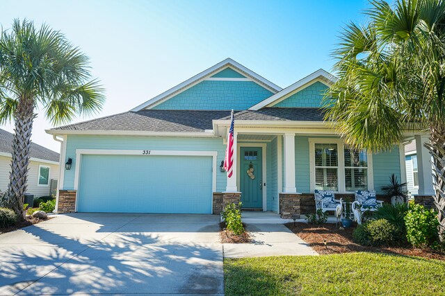 craftsman-style home featuring a garage and a porch