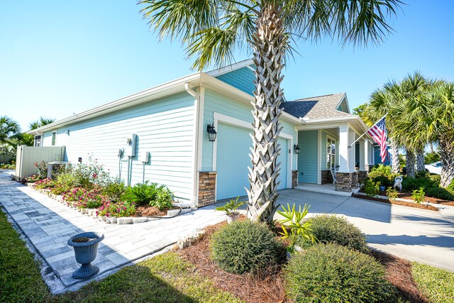 view of side of property with a garage