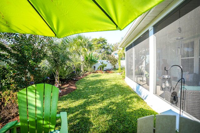 view of yard with a sunroom