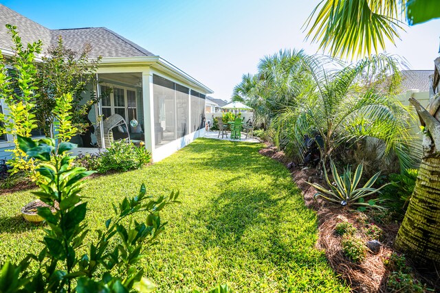 view of yard with a patio and a sunroom