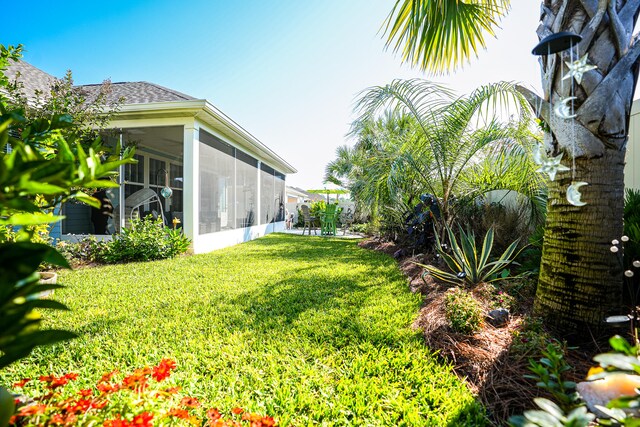 view of yard featuring a sunroom