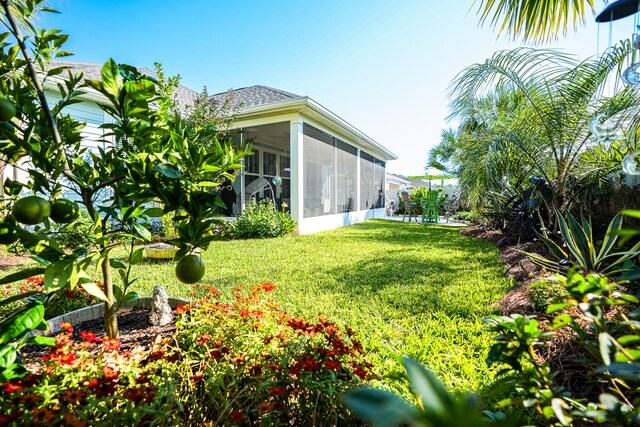 view of yard with a sunroom