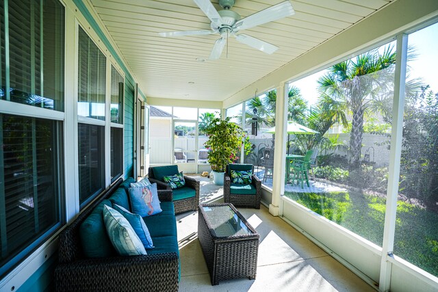 sunroom / solarium featuring ceiling fan and plenty of natural light