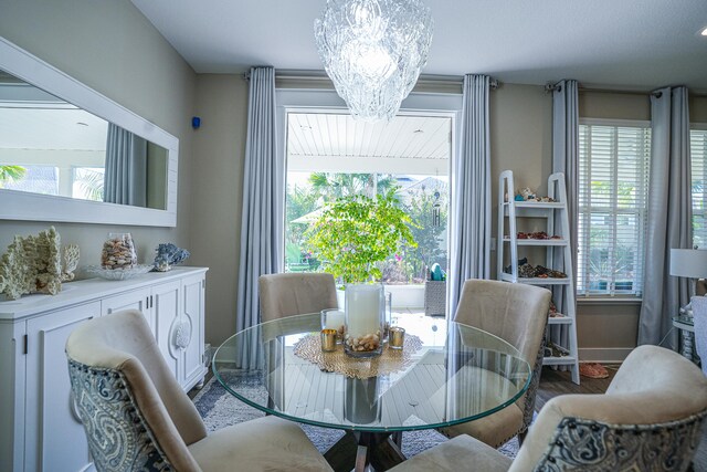 dining area featuring a notable chandelier and a healthy amount of sunlight