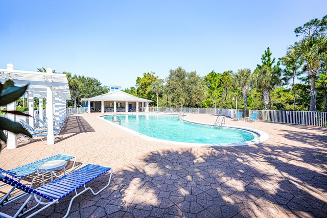 view of pool with a gazebo and a patio area