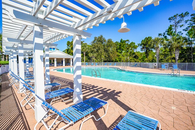 view of pool featuring a patio area and a pergola