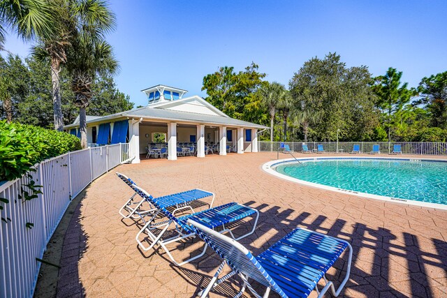 view of swimming pool featuring a patio