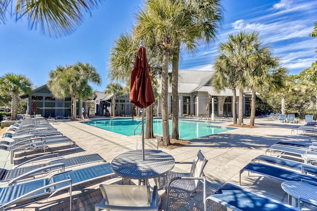 view of swimming pool with a patio area