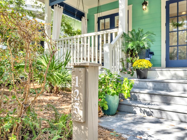 property entrance with covered porch