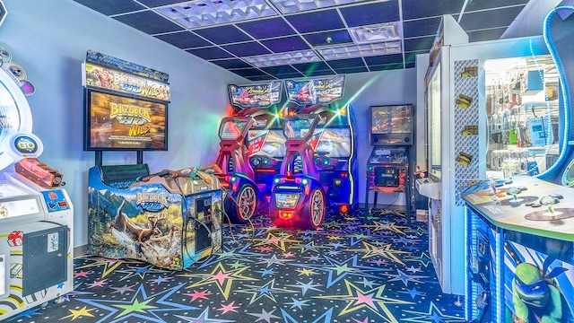 game room featuring a drop ceiling