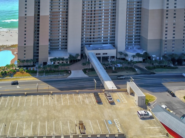 aerial view featuring a water view and a view of the beach