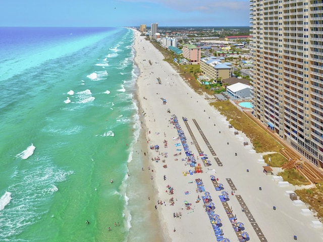 aerial view featuring a view of the beach and a water view