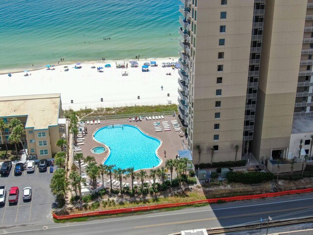 bird's eye view featuring a water view and a view of the beach