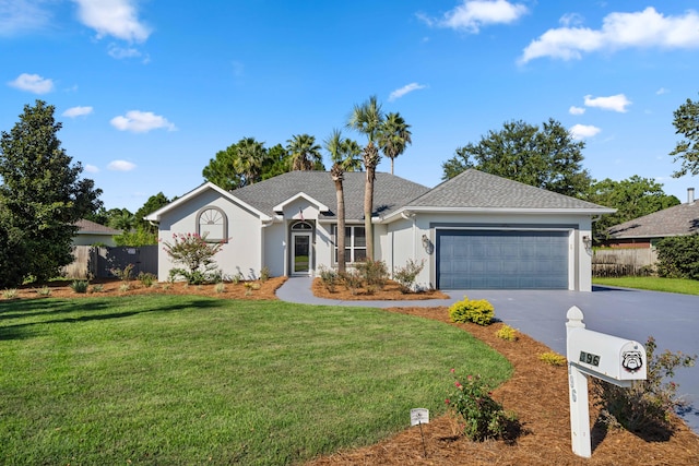 single story home featuring a front lawn and a garage