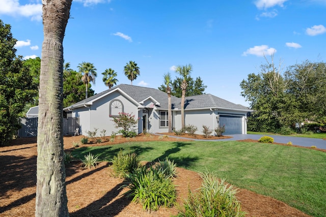 ranch-style home featuring a front yard and a garage