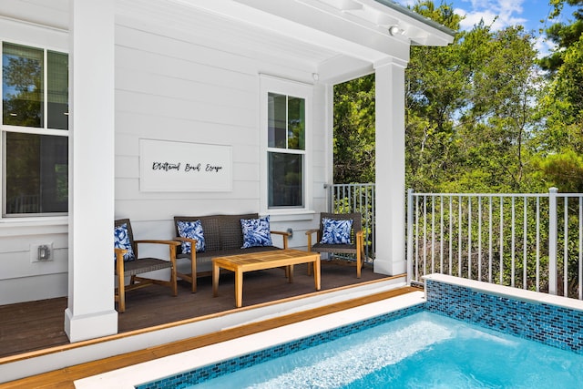 view of swimming pool with a wooden deck