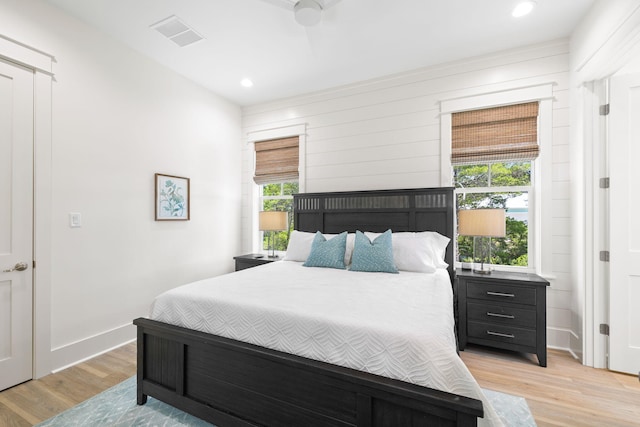 bedroom with light wood-type flooring and ceiling fan