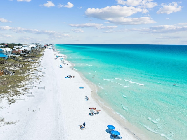 aerial view featuring a water view and a view of the beach