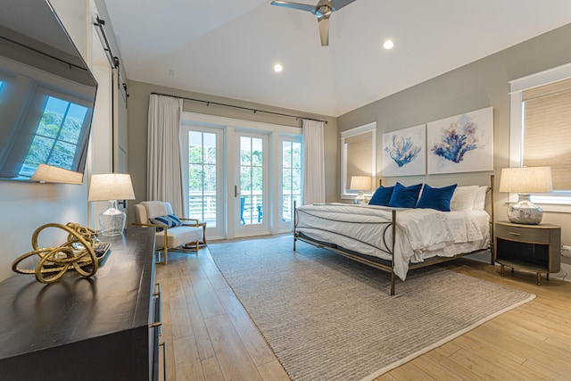 bedroom with ceiling fan, access to outside, multiple windows, and light hardwood / wood-style floors