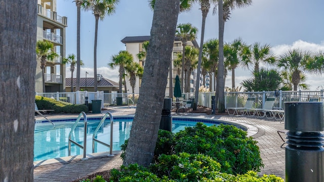 view of pool featuring a patio