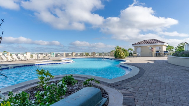 view of pool featuring a patio