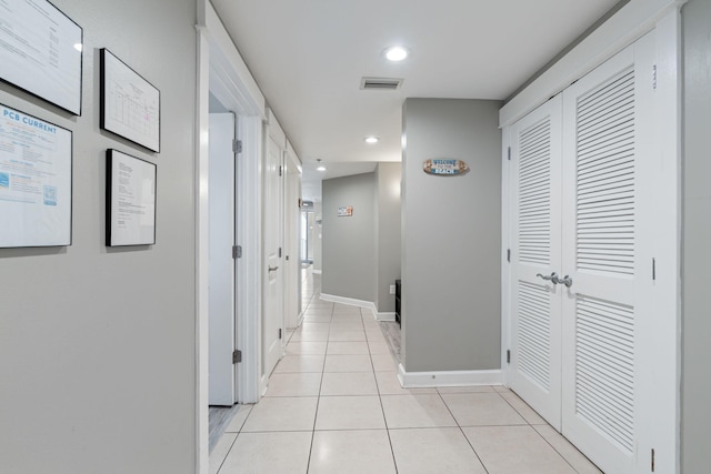 hallway featuring light tile patterned floors