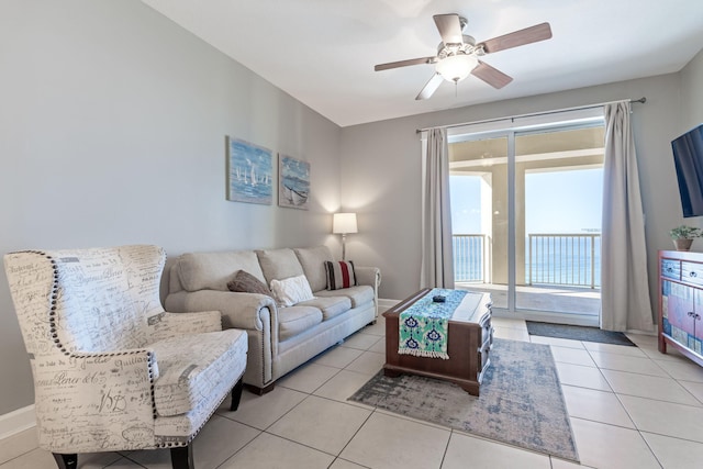 living room with light tile patterned flooring and ceiling fan