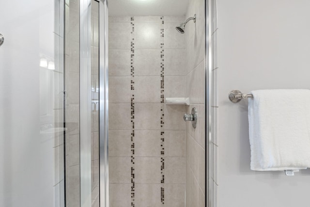 interior space featuring an enclosed shower