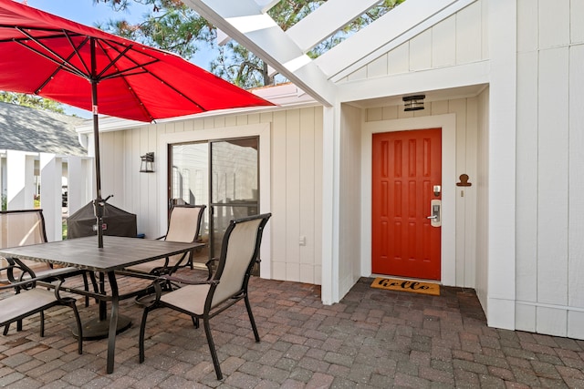 property entrance with a patio