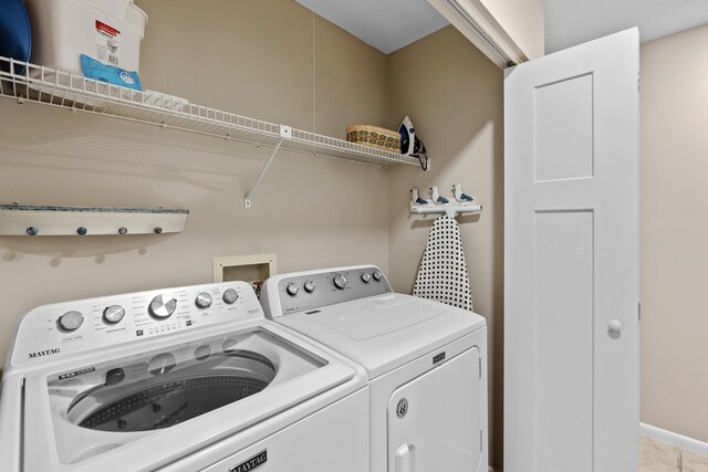 laundry room with independent washer and dryer