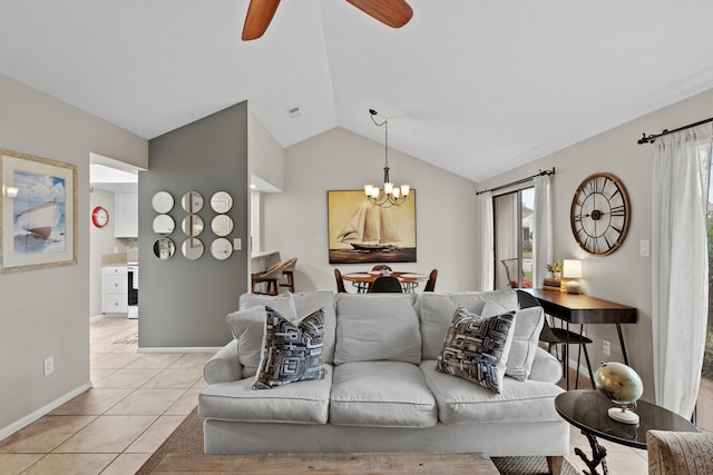 living room with ceiling fan with notable chandelier, light tile patterned floors, and vaulted ceiling