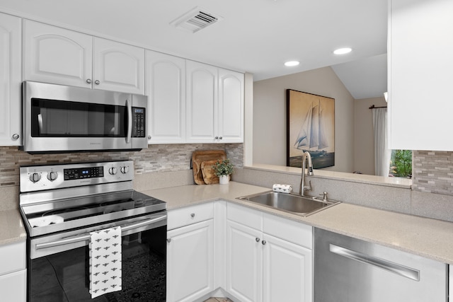 kitchen featuring white cabinetry, sink, and stainless steel appliances