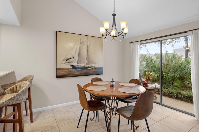 tiled dining space featuring lofted ceiling and a notable chandelier