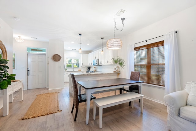 dining room featuring light hardwood / wood-style floors