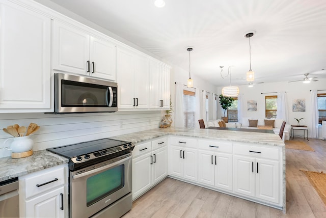 kitchen with stainless steel appliances, light hardwood / wood-style floors, white cabinetry, and kitchen peninsula