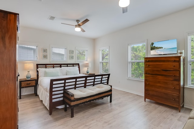 bedroom with light hardwood / wood-style flooring and ceiling fan