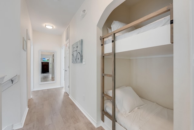 hallway with light hardwood / wood-style flooring