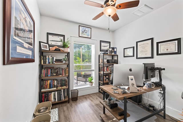 office space with hardwood / wood-style floors and ceiling fan