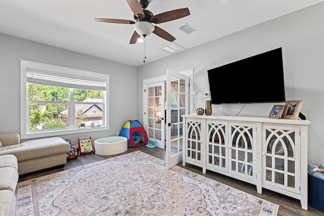 bedroom featuring french doors, hardwood / wood-style floors, and ceiling fan