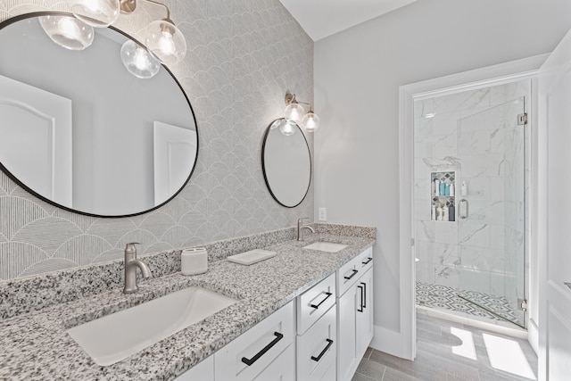 bathroom with vanity, walk in shower, and wood-type flooring