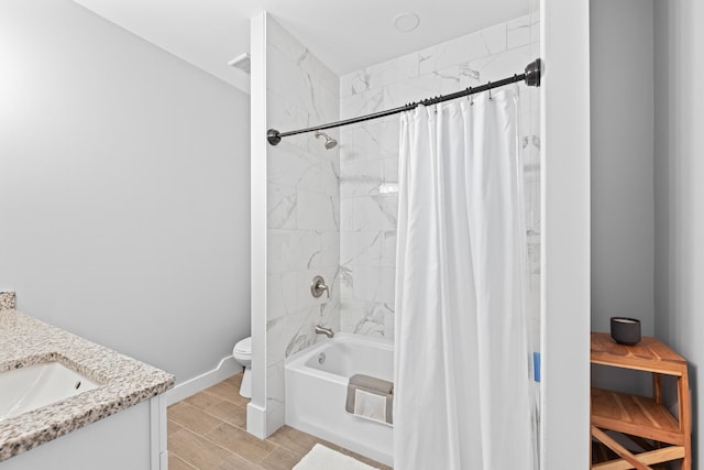 full bathroom featuring toilet, shower / bath combo, hardwood / wood-style flooring, and vanity