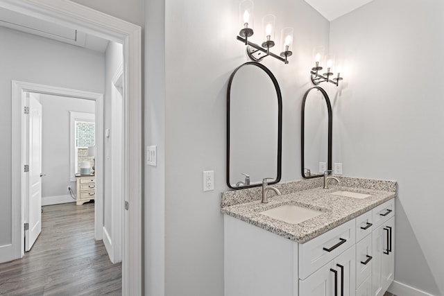 bathroom featuring vanity and hardwood / wood-style flooring